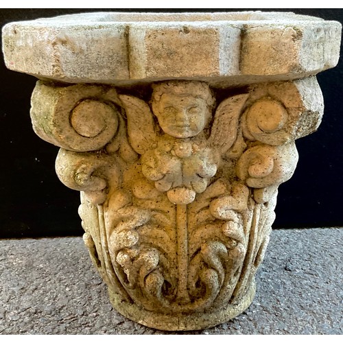 3072 - A  reconstituted capital, moulded with cherubs and acanthus leaves, 31cm high, 39cm wide


**Please ... 