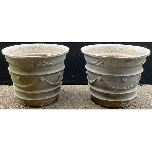 3082 - A pair of 19th century style lead garden planters, of tapering cylindrical form, cast with swags, 29... 