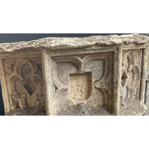 3028 - A 19th century carved stone and composition octagonal church font, carved with a gothic style tracer... 