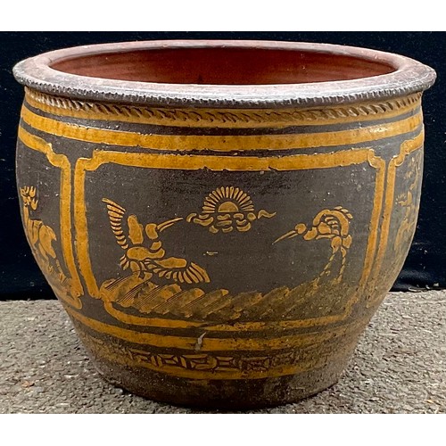 3104 - A large garden terracotta  plant pot, decorated in mustard with stylised birds and animals on a brow... 