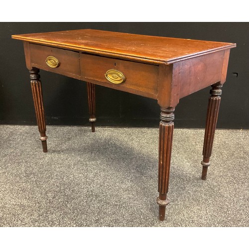 39 - A 19th century oak side table, over sailing top, two frieze drawers, reeded tapering legs, 73.5cm hi... 