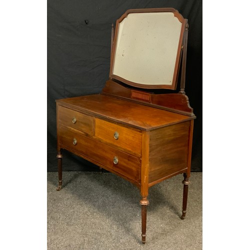 57 - An Edwardian mahogany dressing table, shaped beveled mirror, turned reeded supports, pair of short d... 