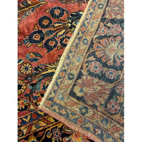 63 - A large Persian, hand-knotted, Moharjeran rug, the central floral medallion within a field of stylis... 