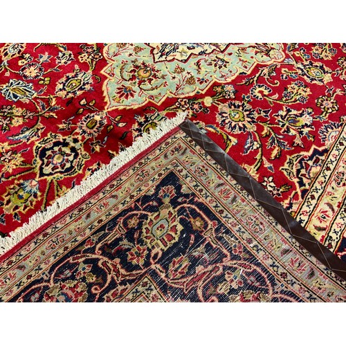 72 - A Central Persian Kashan carpet / rug, knotted in tones of red, pale blue, and deep indigo, 285cm x ... 