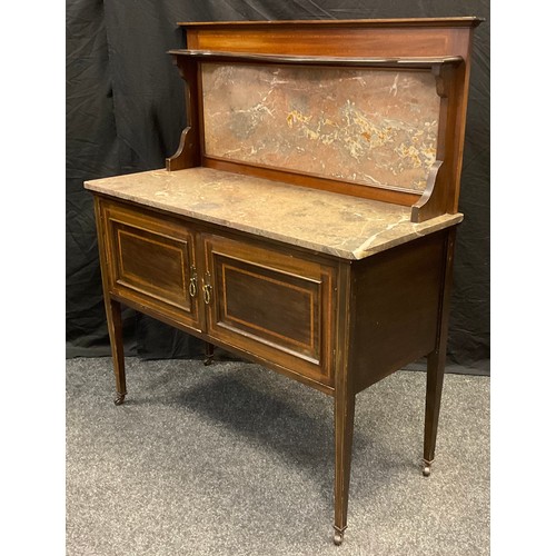 76 - An Edwardian walnut and mahogany washstand, king wood banding, fossil-stine top and back-splash, pai... 