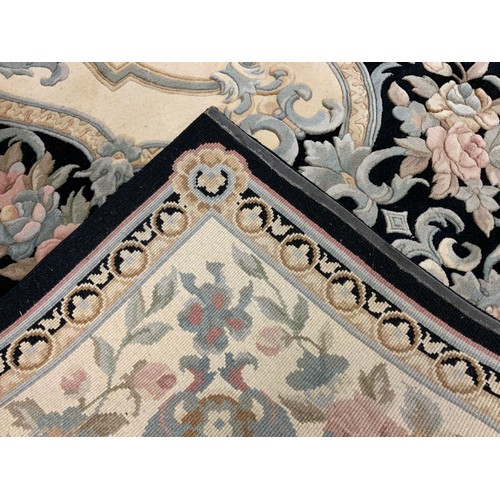 104 - A pure wool Chinese 'Savonnerie' rug / carpet, made for G. H. Frith of Bodelwyddan, UK, in black, wi... 