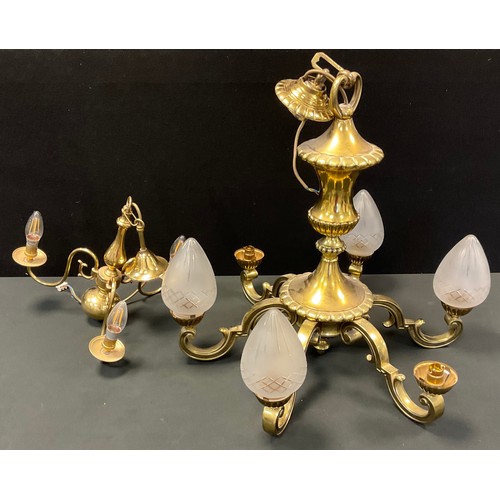 105 - A Neoclassical style brass six branch chandelier, urnular body, scrolling arms, frosted and cut glas... 