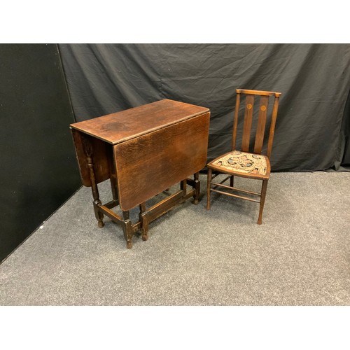 114 - A late 19th century arts and crafts inlaid parlour chair, shaped plain rail, inlaid splats, floral u... 