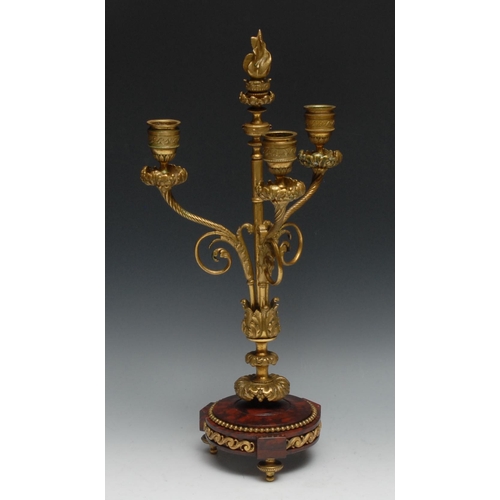 1398 - A 19th century gilt bronze and rosso antico marble table centre three-light candelabrum, flame finia... 