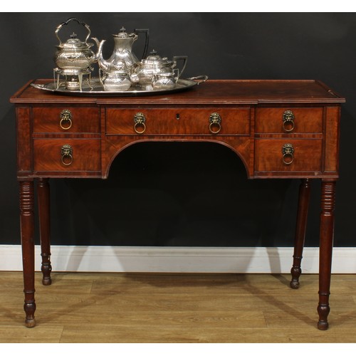 1766 - A Regency mahogany serving table, slight breakfront top with reeded edge above an arrangement of fou... 