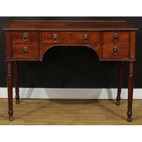 1766 - A Regency mahogany serving table, slight breakfront top with reeded edge above an arrangement of fou... 