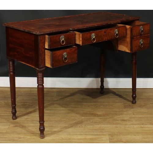 1766 - A Regency mahogany serving table, slight breakfront top with reeded edge above an arrangement of fou... 