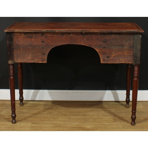 1766 - A Regency mahogany serving table, slight breakfront top with reeded edge above an arrangement of fou... 