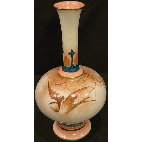 568 - A Hadley's Worcester slender bottle vase, painted in sepia tones with a swallow in flight, the neck ... 