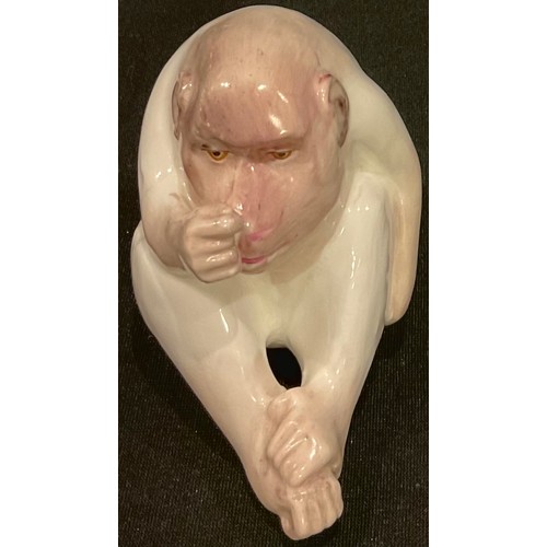 632 - A Royal Worcester 'netsuke', of a white ape, seated, 7cm high, crown and circle mark in green, c.191... 