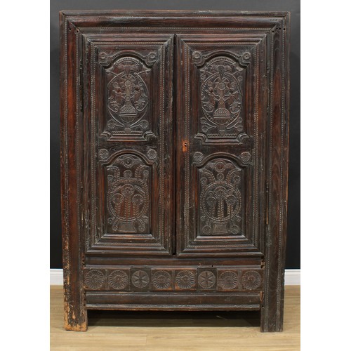 1649 - A late 17th century oak livery cupboard or housekeeper's cupboard, flush stiled frame centred by a p... 