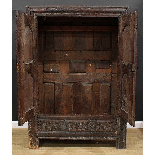 1649 - A late 17th century oak livery cupboard or housekeeper's cupboard, flush stiled frame centred by a p... 