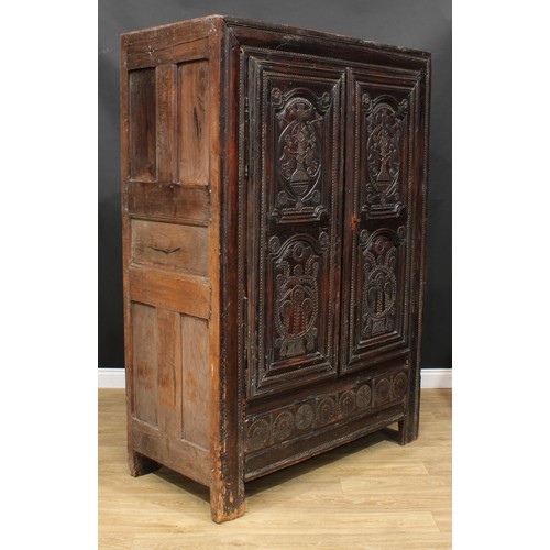 1649 - A late 17th century oak livery cupboard or housekeeper's cupboard, flush stiled frame centred by a p... 