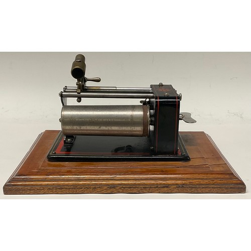 1327 - An early 20th century Excelsior EWC phonograph, in black, outlined in red, 30cm wide