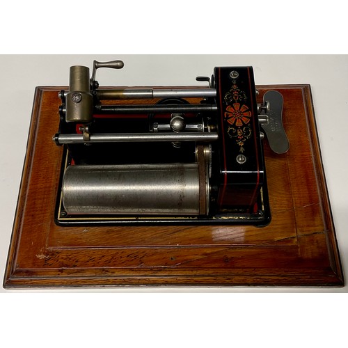 1327 - An early 20th century Excelsior EWC phonograph, in black, outlined in red, 30cm wide