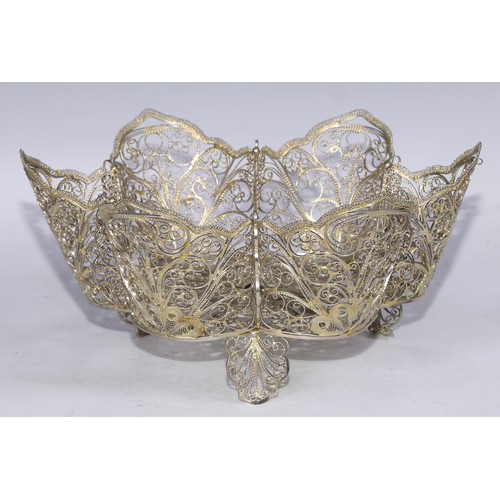 184 - A gilt silver coloured metal filigree shaped circular basket, possibly Russian, 27cm diam, apparentl... 