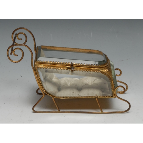 1271 - A French gilt metal novelty bijouterie display casket, as a sledge, bevelled panels, 18cm long, earl... 