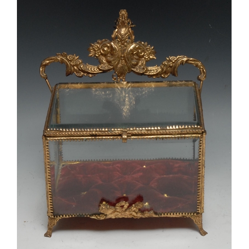 1268 - A French gilt metal bijouterie vitrine casket, Rococo cresting, hinged cover, bevelled panels, scrol... 