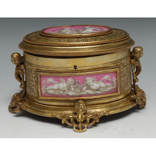 1257 - A 19th century French Palais Royal ormolu and porcelain mounted gilt brass oval table casket, hinged... 