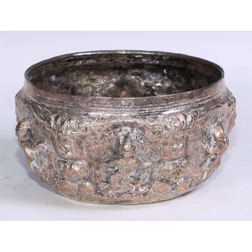 86 - A Burmese silver coloured metal bowl, repousse chased with nat sein, 16.5cm diam, marked to base, 35... 