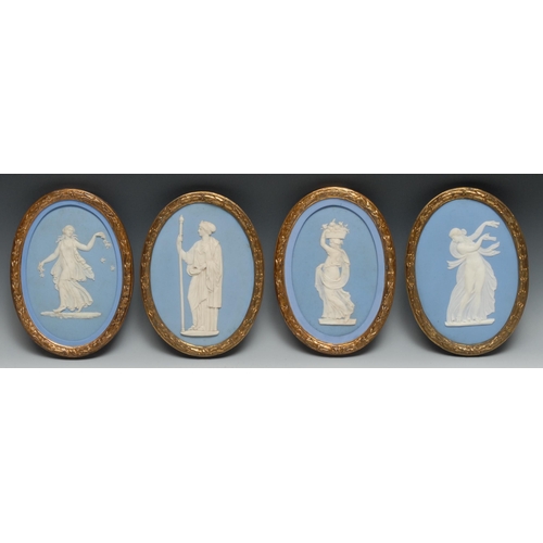 553 - A pair of 19th century Wedgwood Jasperware oval plaques, typically sprigged with classical figures i... 