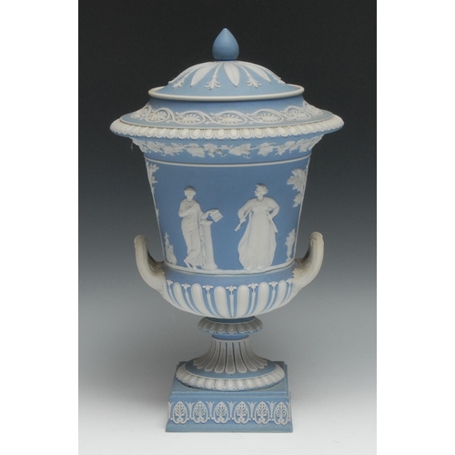 546 - A 19th century Wedgwood Jasperware two handled pedestal campana shaped vase and cover, typically spr... 