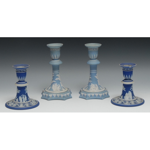 550 - A pair of 19th century Wedgwood Jasperware candlesticks, typically sprigged with classical figures, ... 