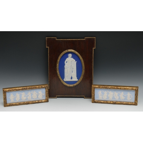 555 - A pair of 19th century Wedgwood Jasperware rectangular plaques, typically sprigged in white with fig... 