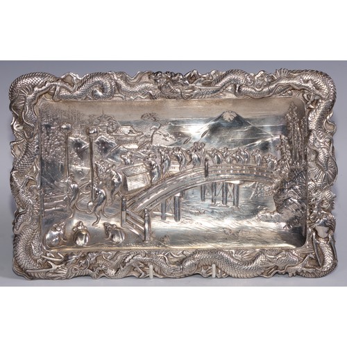 995 - A Japanese antimony shaped rectangular tray, embossed with a procession of rats, dragons to border, ... 