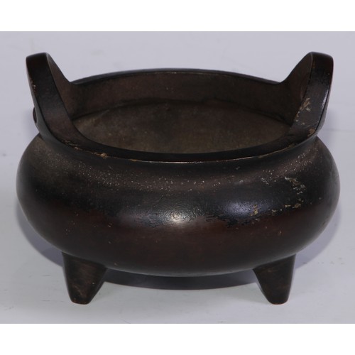 908 - A Chinese bronze ding tripod censer, loop handles, 12cm diam, character marks