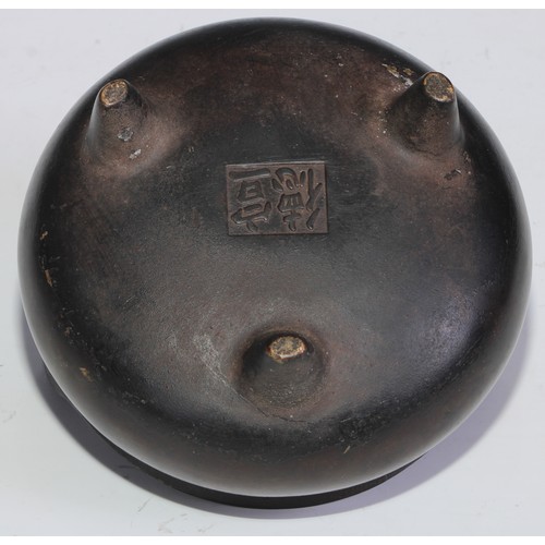 908 - A Chinese bronze ding tripod censer, loop handles, 12cm diam, character marks