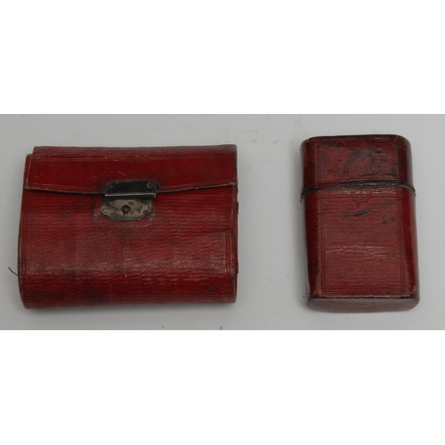 1260 - A 19th century red morocco leather needle case, silver coloured metal clasp, 7.5cm wide; an etui, si... 