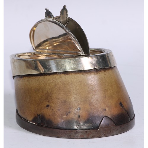 1293 - A Victorian E.P.N.S mounted horse hoof twin-compartment table snuff box, the hinged covers outlined ... 