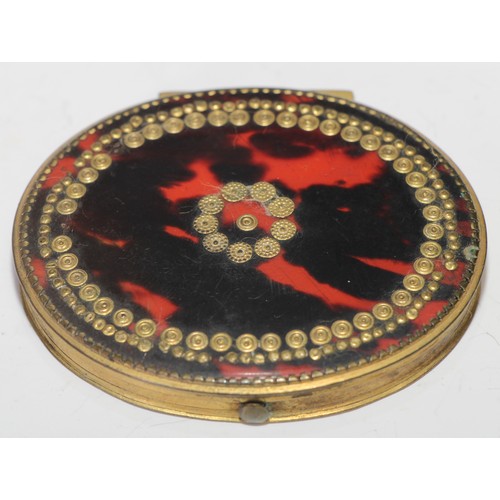 1294 - An 18th century tortoiseshell and gilt metal oval snuff box, hinged cover decorated with pique round... 