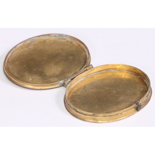 1294 - An 18th century tortoiseshell and gilt metal oval snuff box, hinged cover decorated with pique round... 