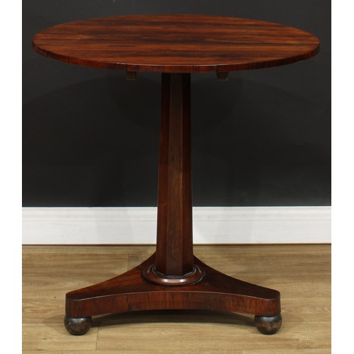 1617 - A George IV rosewood pedestal centre table, circular tilting top, panelled column, incurve triform b... 