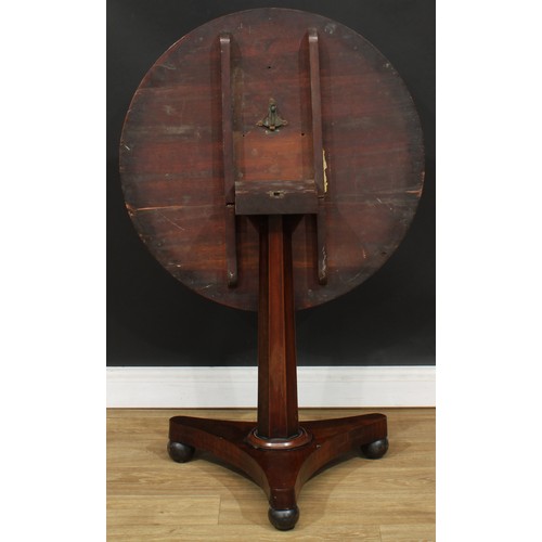 1617 - A George IV rosewood pedestal centre table, circular tilting top, panelled column, incurve triform b... 