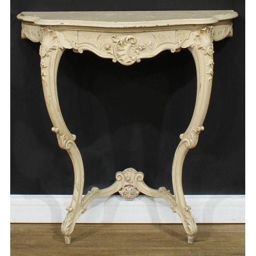 1778 - A Rococo Revival painted console table, oversailing serpentine top above a frieze drawer, carved wit... 