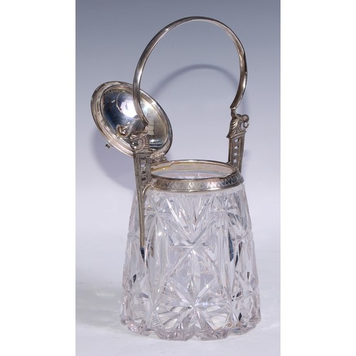 25 - A Secessionist E.P.N.S mounted cut glass biscuit box, arched handle springing from griffin crested b... 