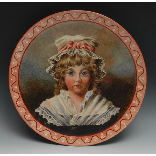 491 - A Pinder Bourne & Co Burslem circular charger, painted with a young girl wearing a lace cap tied wit... 