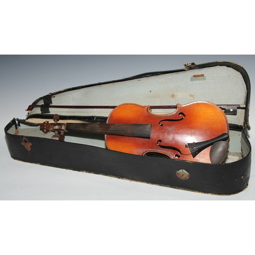 1311 - A violin, the two piece back 35.75cm long excluding button, paper label printed Dulcis et Fortis, ro... 