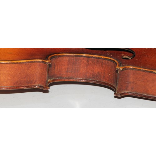 1311 - A violin, the two piece back 35.75cm long excluding button, paper label printed Dulcis et Fortis, ro... 