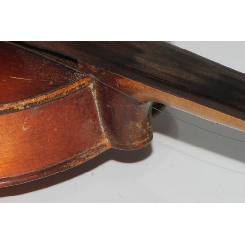 1311 - A violin, the two piece back 35.75cm long excluding button, paper label printed Dulcis et Fortis, ro... 