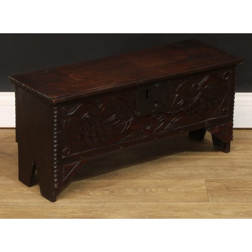 1834 - A small ‘18th century’ oak six plank chest, of child’s coffer proportions, hinged top, the front car... 