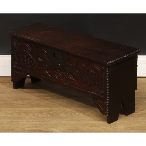 1834 - A small ‘18th century’ oak six plank chest, of child’s coffer proportions, hinged top, the front car... 